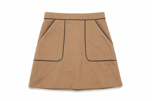 Front view of Miss Selfridge women’s beige polyester mini skirt, size UK 4, zip