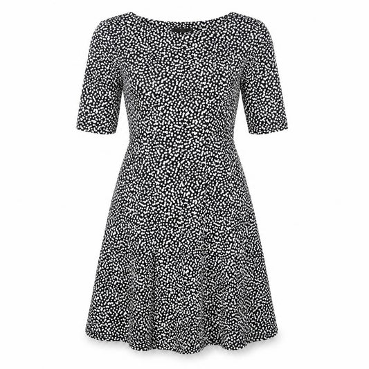 Front view of Connected Apparel women’s black polka dot polyester a-line, size UK 10, boat neck
