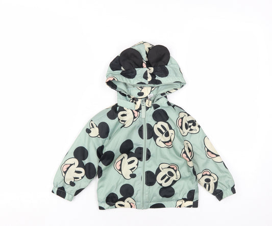 Front view of Disney girls’ green geometric rain coat coat, size 18, months zip - mickey mouse
