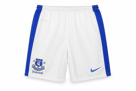 Front view of Nike boys’ white & blue football shorts, size 8-10, years