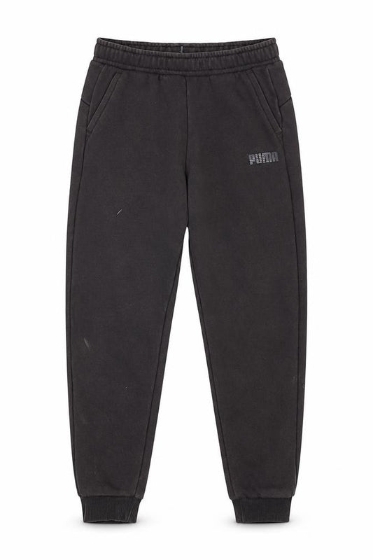 Front view of Puma boys’ black jogger trousers, size 7-8, years