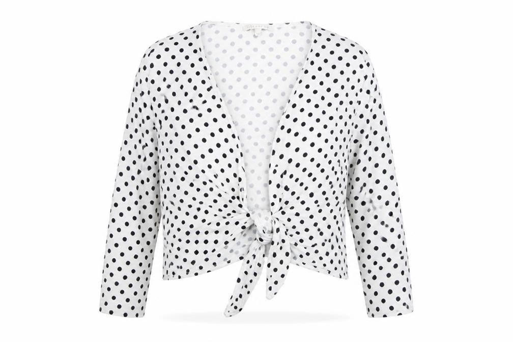 Front view of Lakeland Women's White Polka Dot Wrap Blouse