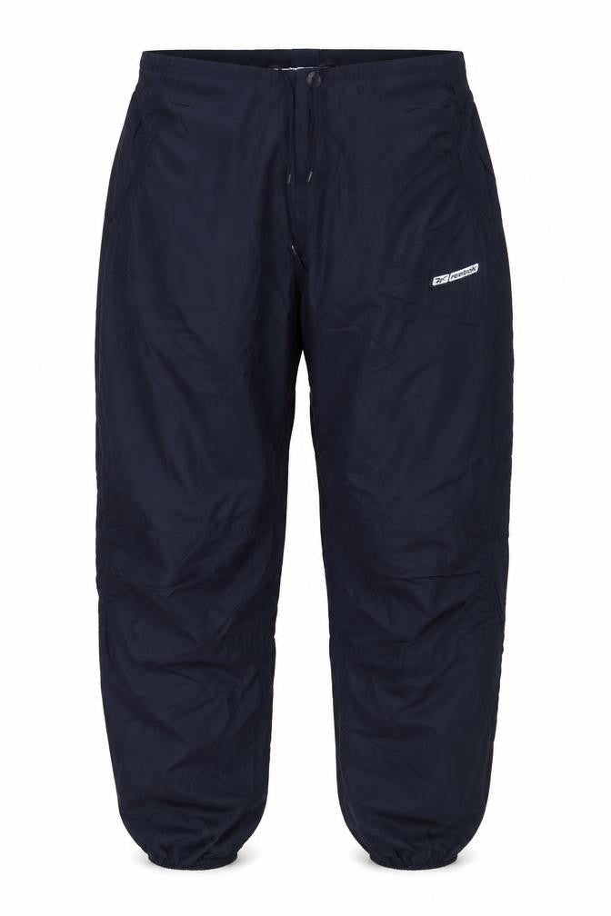 Front view of Reebok unisex adults black rain trousers, size 14