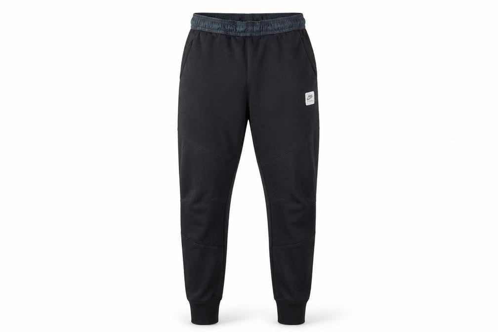 Front view of Nike boys’ black jogger trousers, size L, with elastic waist