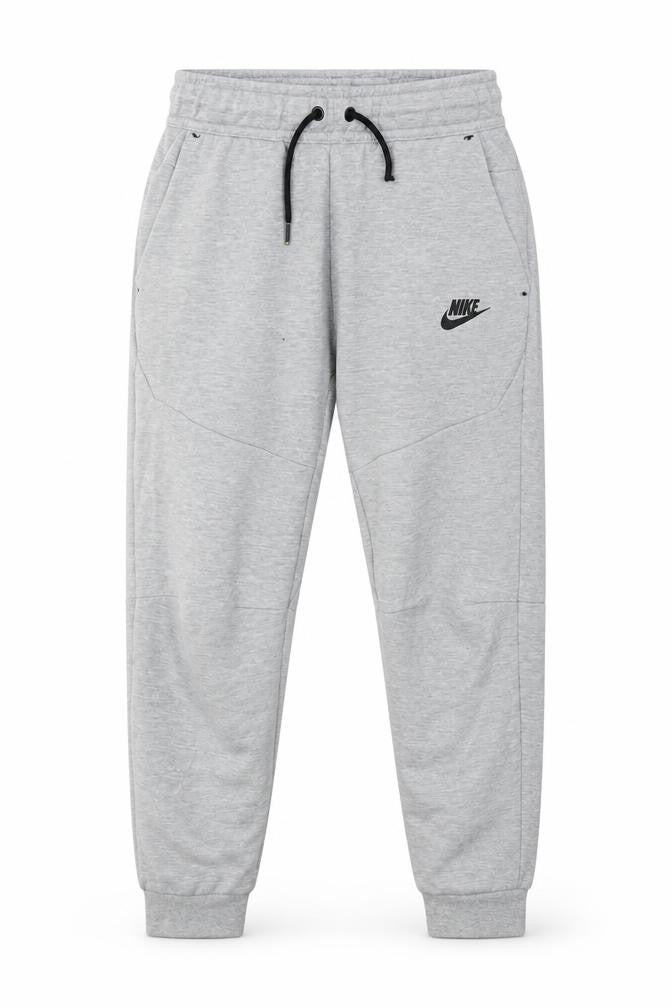 Front view of Nike boys’ grey jogger trousers, m, elastic waist, activewear