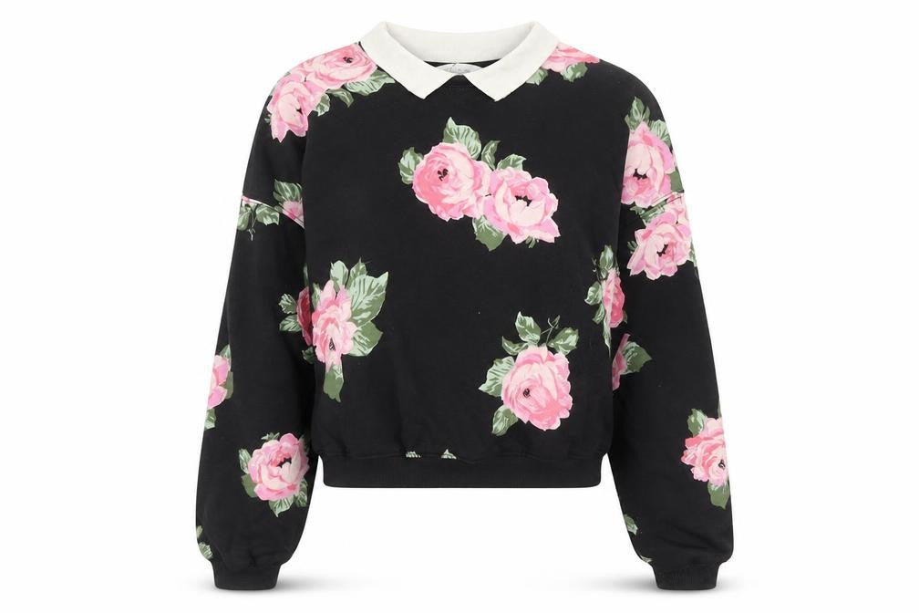 Front view of H&M girls’ black floral sweatshirt pullover 13-14 years