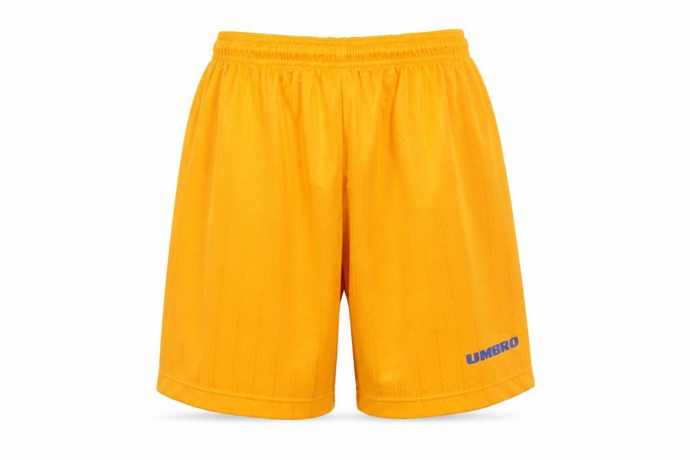 Front view of Umbro boys’ yellow athletic shorts, size 164