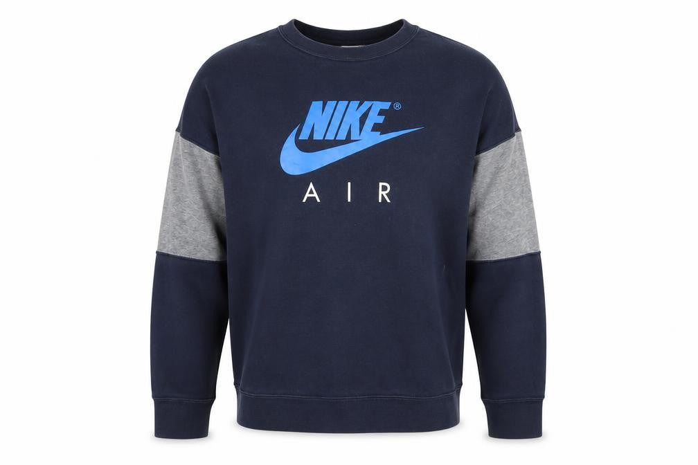 Front view of Nike boys’ blue crew neck sweatshirt l with logo accents