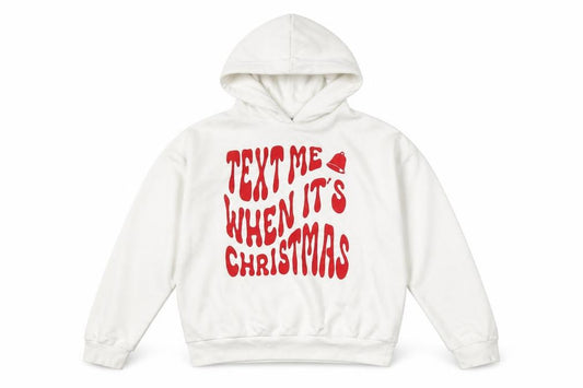 Front view of Destination girls’ white pullover hoodie, christmas graphic, size 12