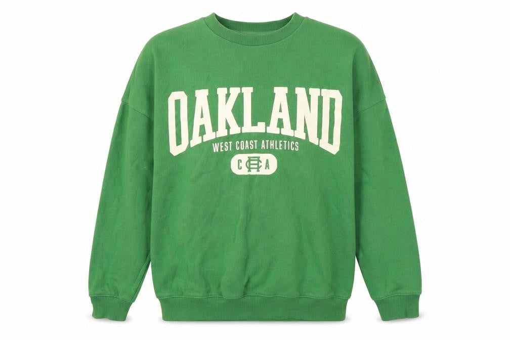 Front view of H&M girls’ green graphic sweatshirt, size 12-13y pullover