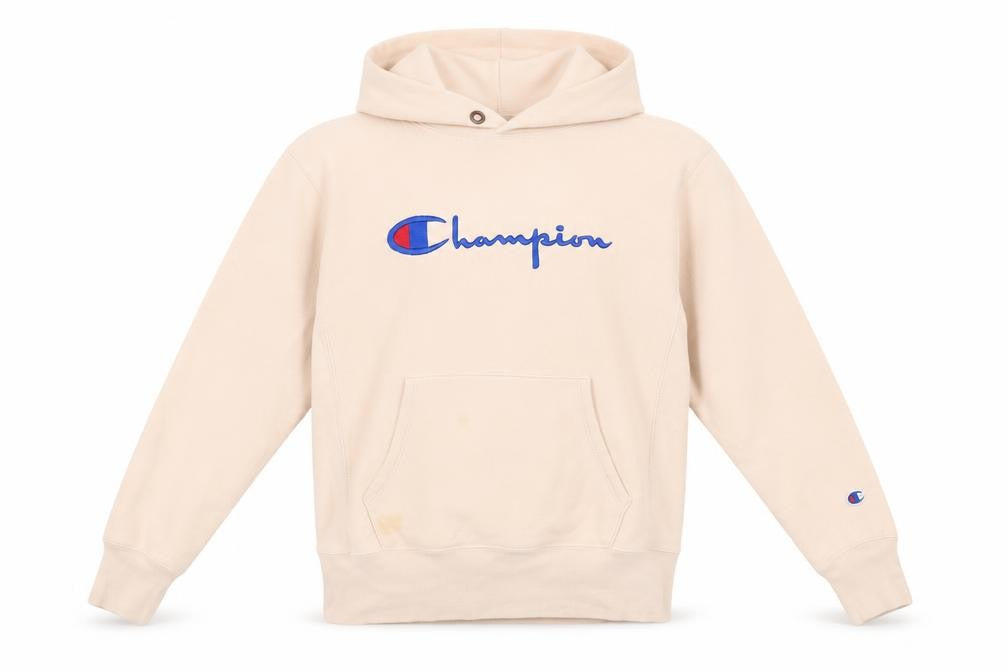 Front view of Champion women’s beige small pullover hoodie embroidered logo