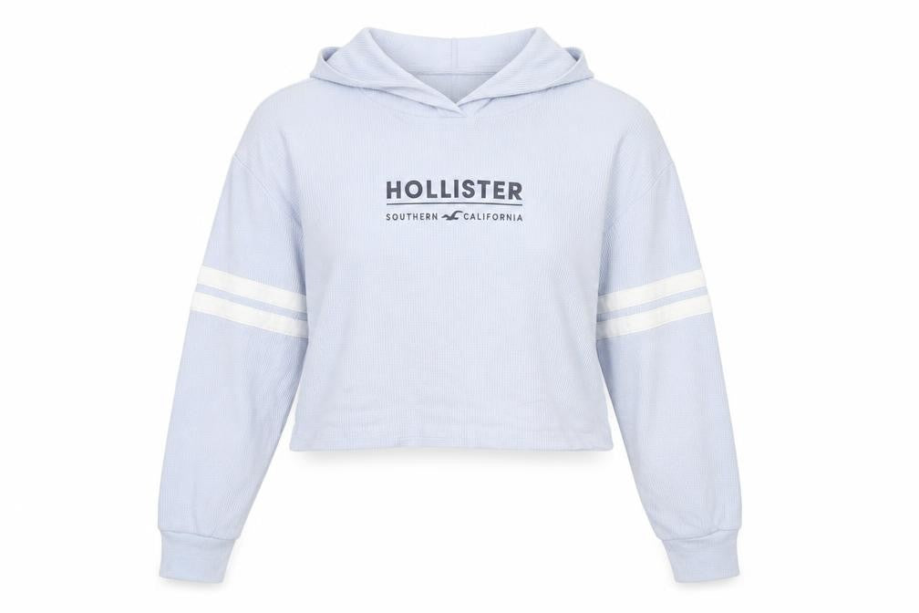 Front view of Hollister women’s blue cropped hoodie medium pullover logo print