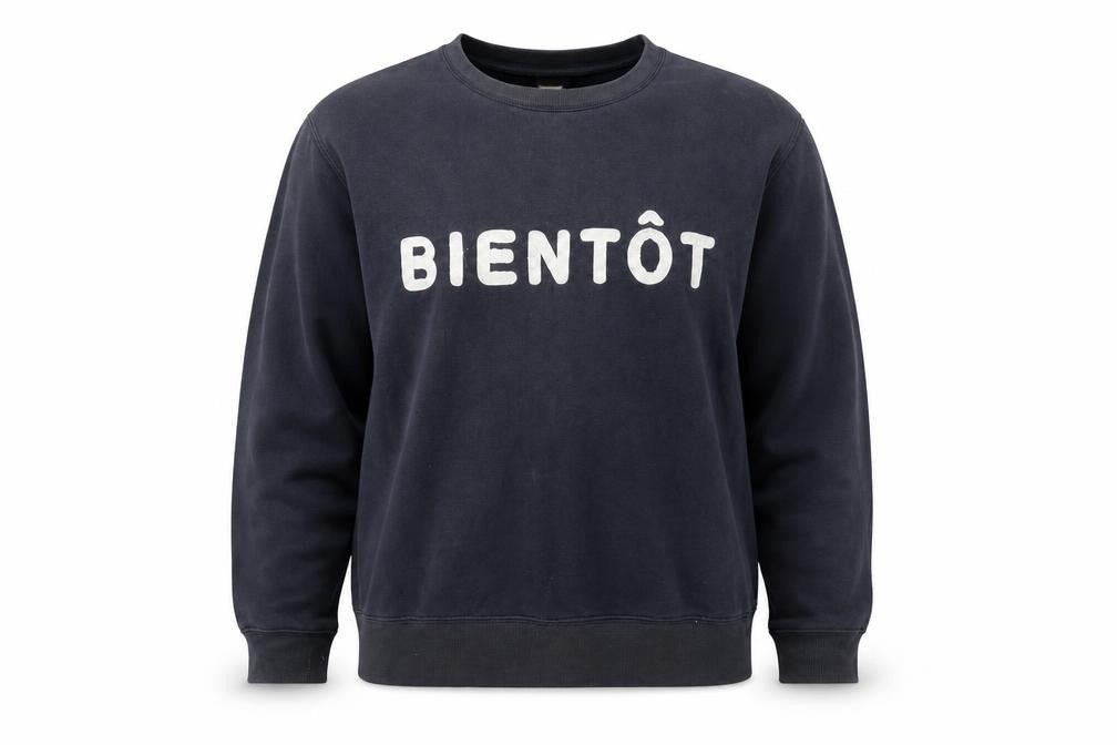 Front view of H&M women’s black sweatshirt l cotton blend graphic print bientôt