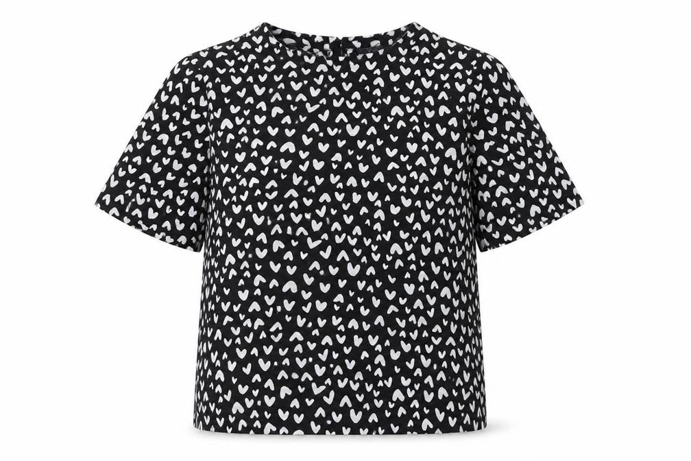 Front view of Marks & Spencer women’s black heart print blouse, size UK 10