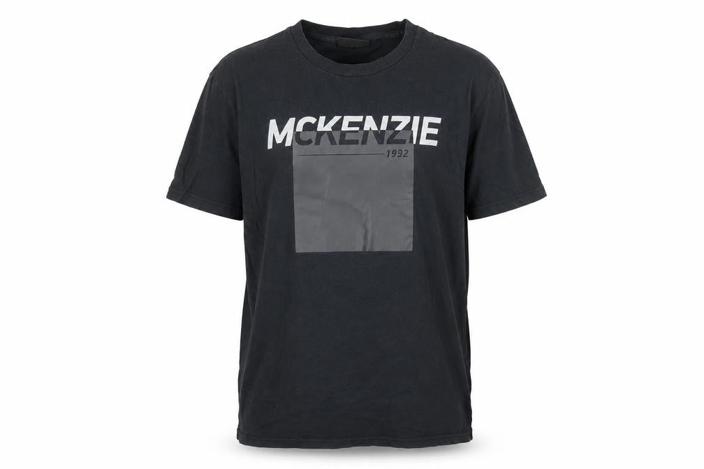 Front view of McKenzie Men's Black Graphic Logo T-Shirt, size L, Regular Fit