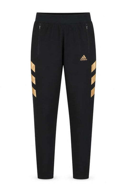 Front view of Adidas boys’ black jogger trousers 13-14 years with gold stripes