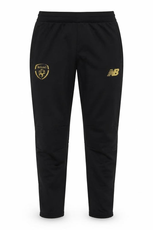Front view of New Balance boys’ black xl track pants football training tapered fit