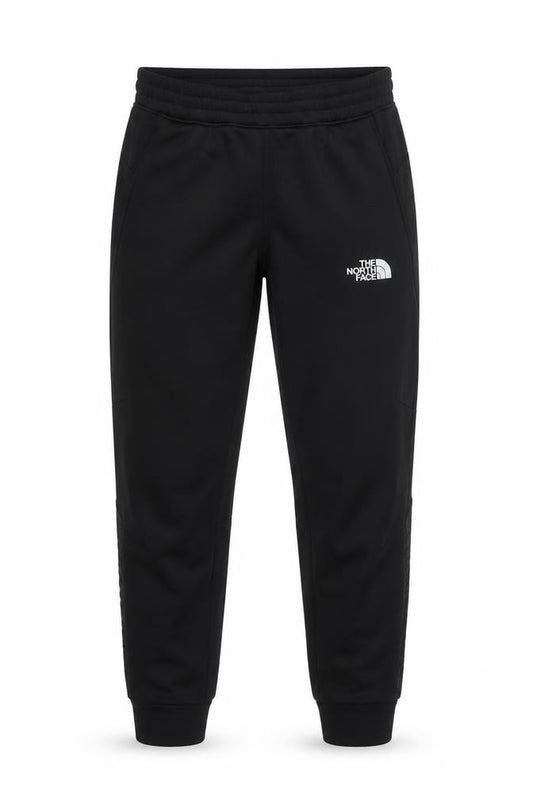 Front view of The North Face boys’ black l joggers softshell polyester outdoor pants