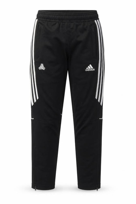 Front view of Adidas boys’ black 13-14 years tapered track pants with side stripes