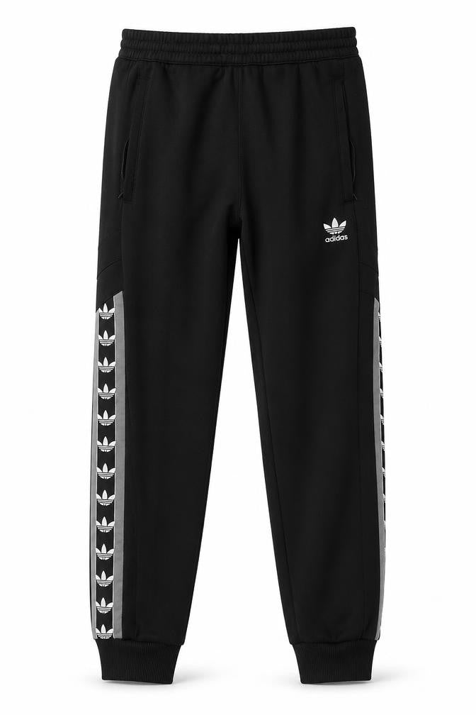 Front view of adidas boys’ black jogger activewear trousers, size S, with side stripe