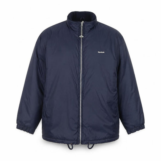 Front view of Reebok Essentials Blue boys’ puffer jacket full zip lined