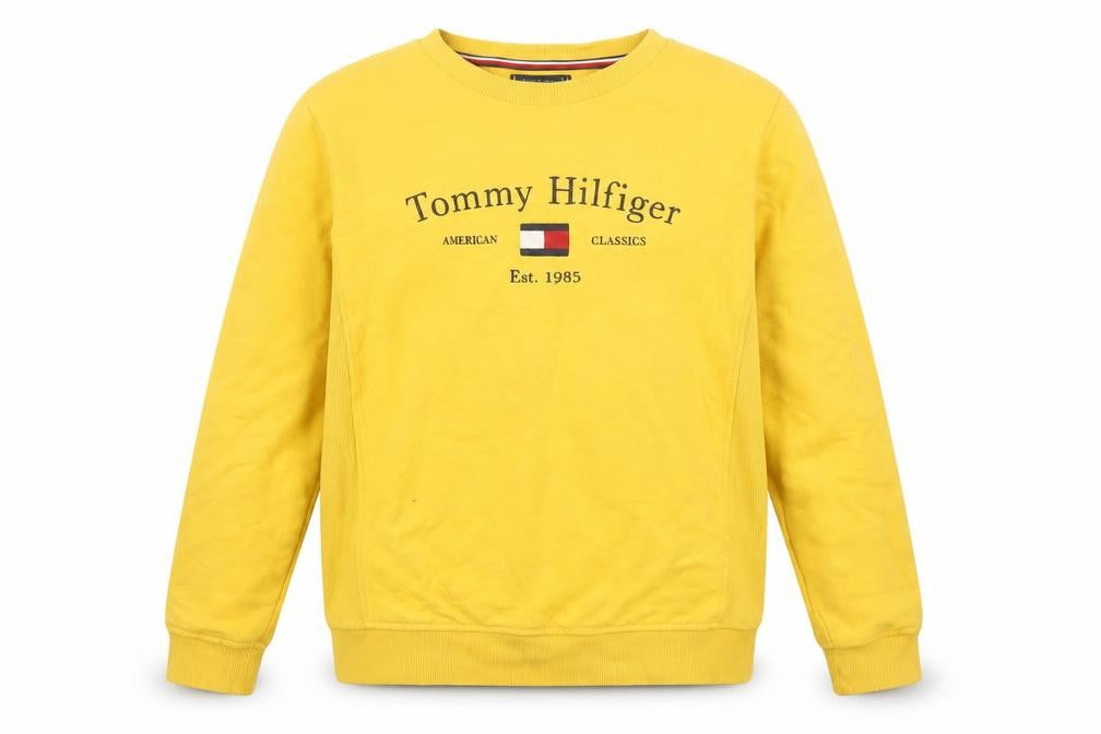 Front view of Tommy Hilfiger boys’ yellow pullover sweatshirt, size 176, crew neck logo