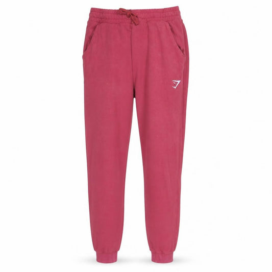 Front view of Gymshark men’s red slim fit jogger sweatpants, size S, activewear trousers
