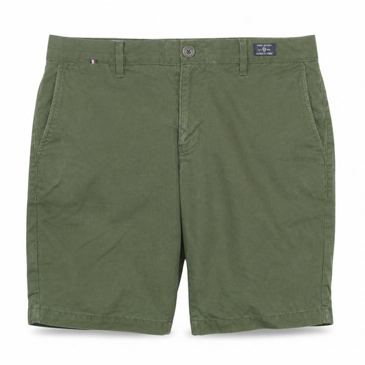 Front view of Tommy Hilfiger boys’ green chino shorts, size 31, regular fit summer casual