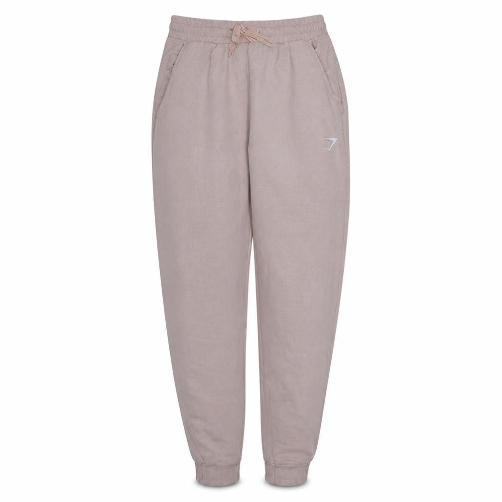 Front view of Gymshark Women's Beige Jogger Trousers, size S, Viscose Blend