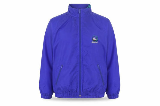 Front view of Reebok women’s blue m 90s windbreaker nylon jacket