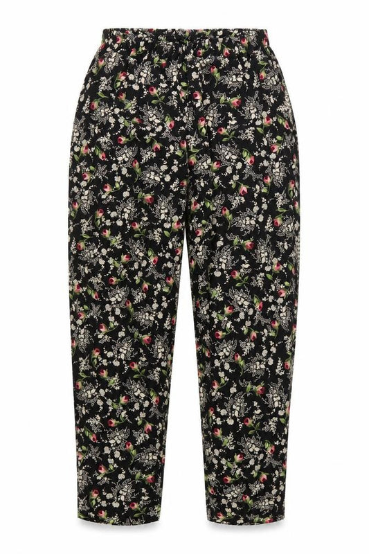Front view of Maggie Sweet women’s black floral tapered trousers medium