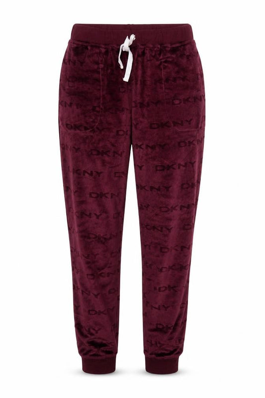 Front view of DKNY women’s purple velour jogger trousers, size M, elastic waist