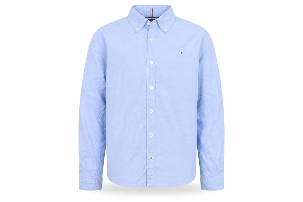 Front view of Tommy Hilfiger boys’ blue long sleeve button-up cotton shirt, size 152