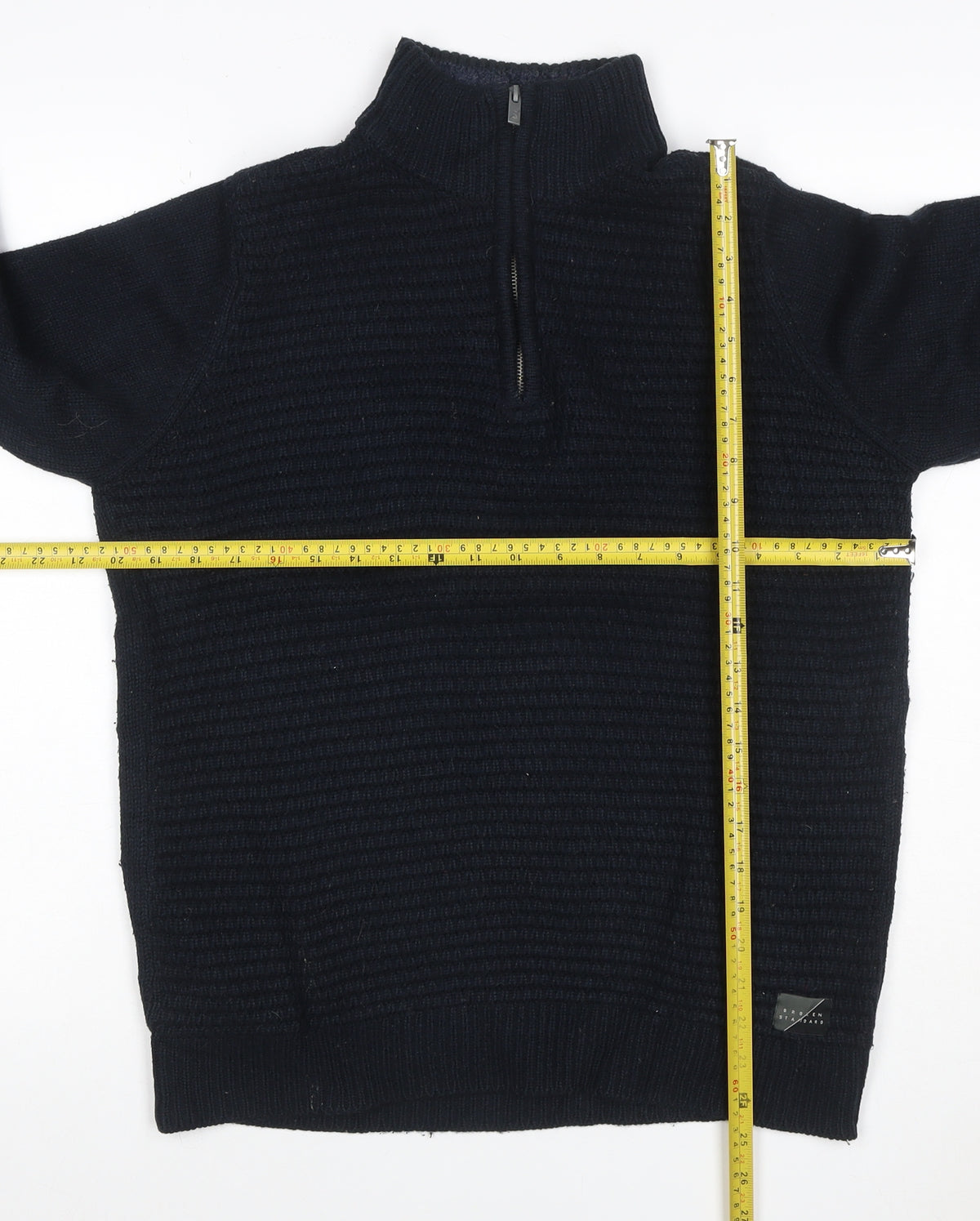Brand and care label for Broken Standard Men’s Black S 1/4 Zip High Neck Knit jumper