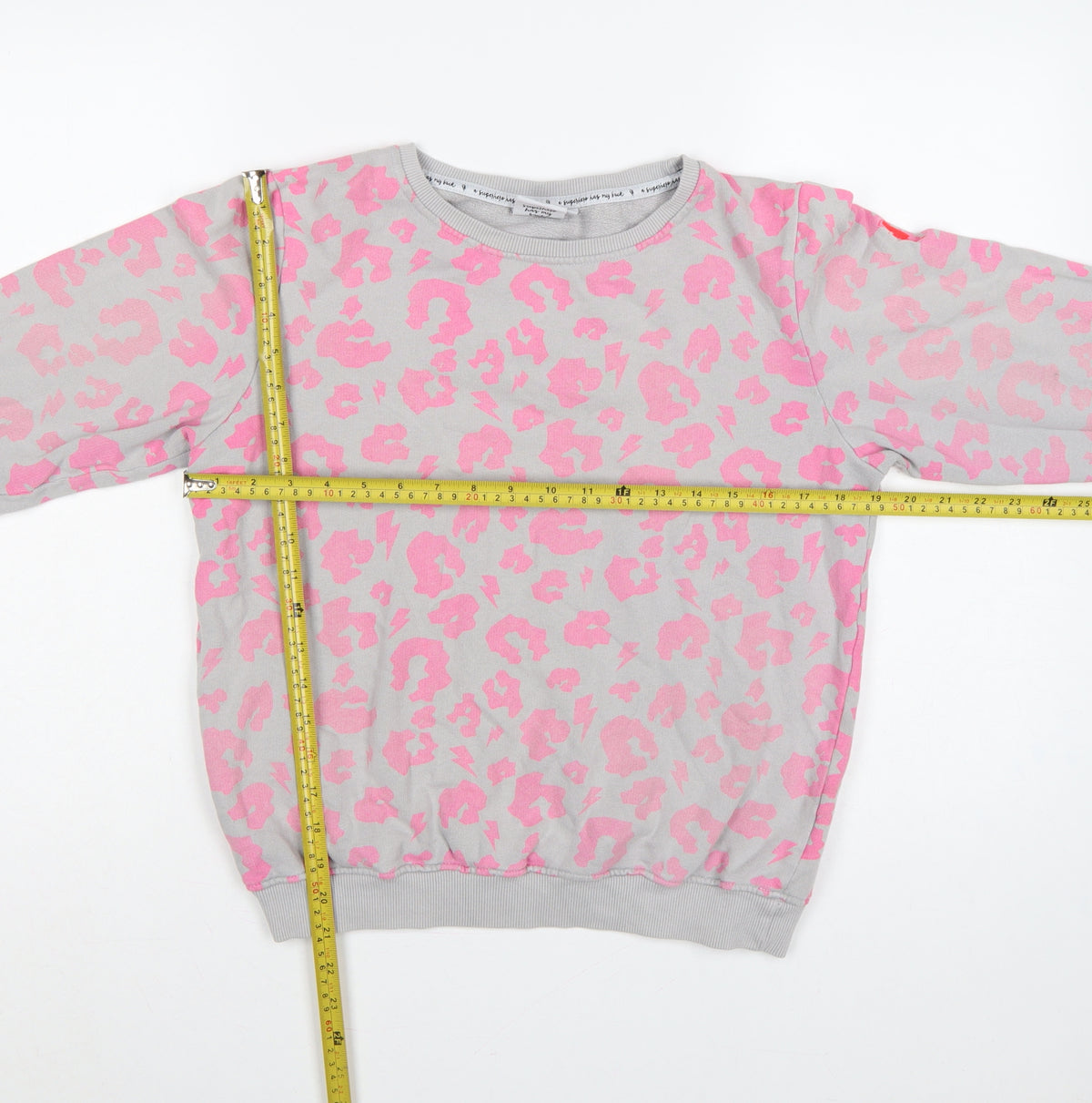 Close-up detail of Scamp & Dude Women’s Grey Pink S Leopard Lightning Sweatshirt