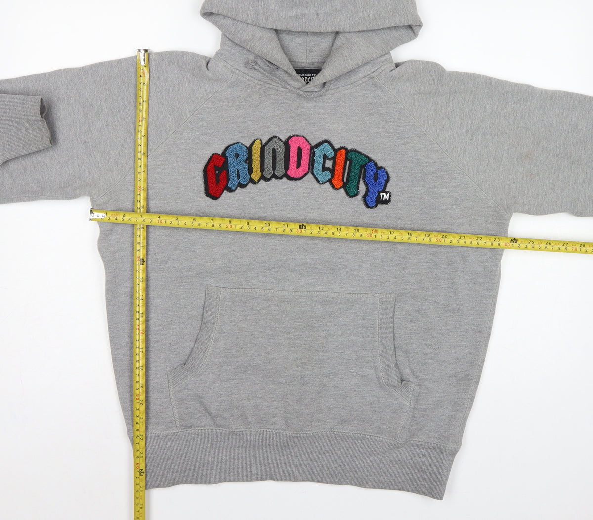 Close-up detail of Grindcity Men’s Grey Medium Pullover Hoodie Embroidered Logo
