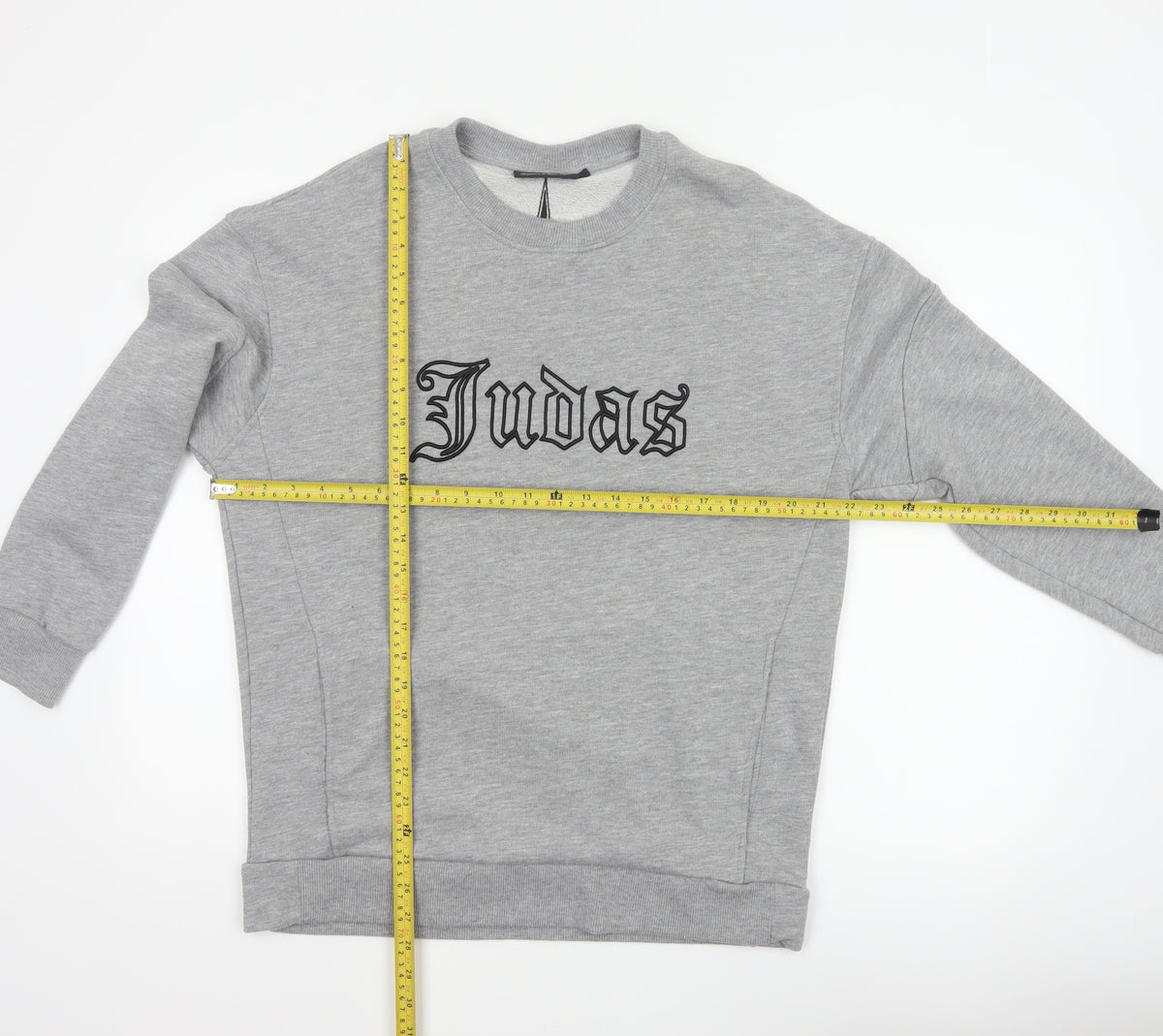 Close-up detail of Judas Sinned Men’s Grey M Gothic Logo Graphic Pullover Sweatshirt