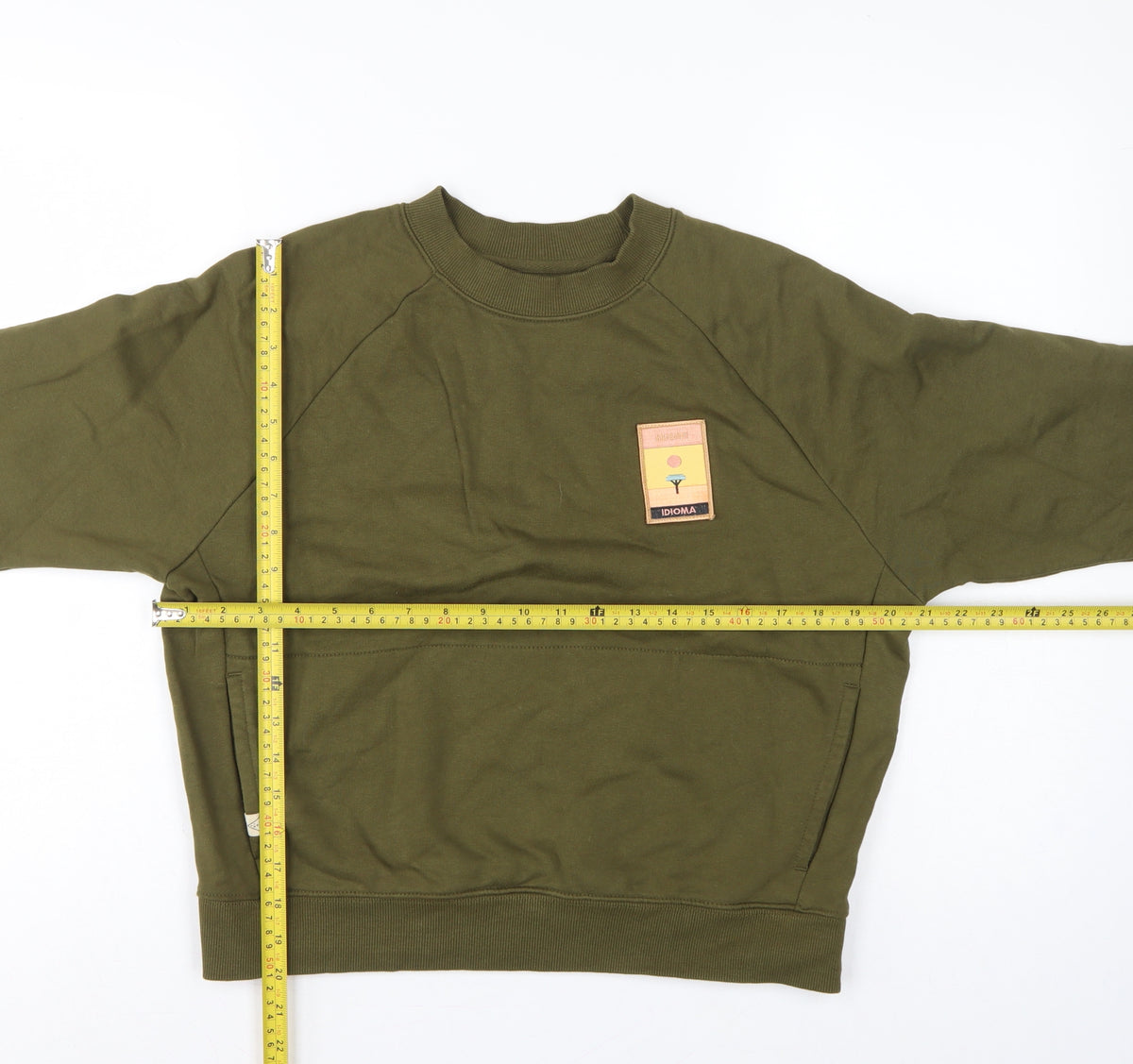 Close-up detail of Idioma Women Green XS Organic Cotton Pullover Sweatshirt Pocket Logo