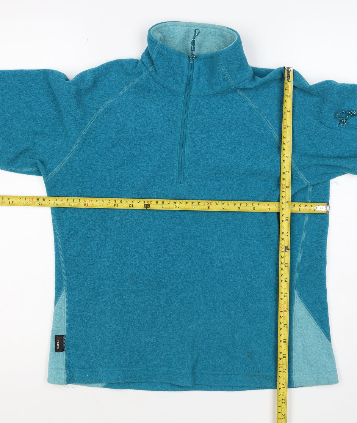 Brand and care label for Mountain Equipment Women’s Blue UK 8 1/2 Zip Fleece Pullover