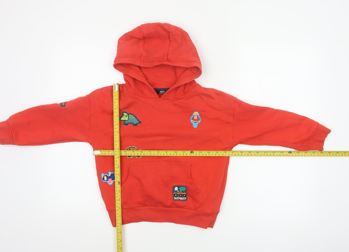Close-up detail of Next unisex kids red 5-6 years pullover hoodie dinosaur patches