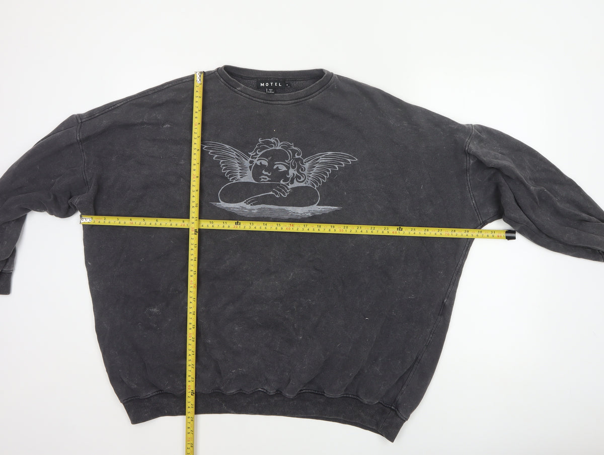 Close-up detail of Motel Women Black S Angel Graphic Oversized Pullover Sweatshirt