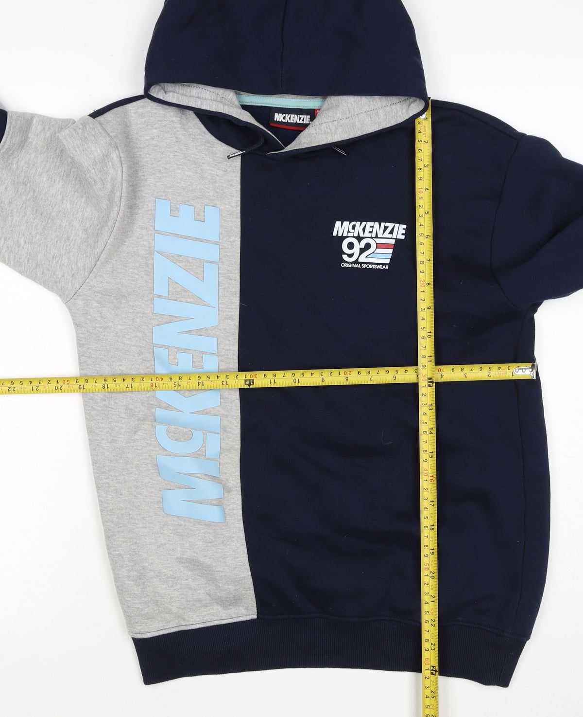 Brand and care label for McKenzie boys’ blue grey 3-4 years pullover logo hoodie