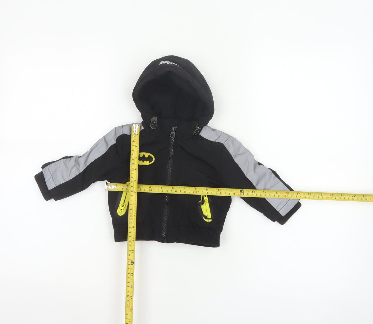 Close-up detail of Batman boys’ black 3-6 months hooded ski jacket reflective logo