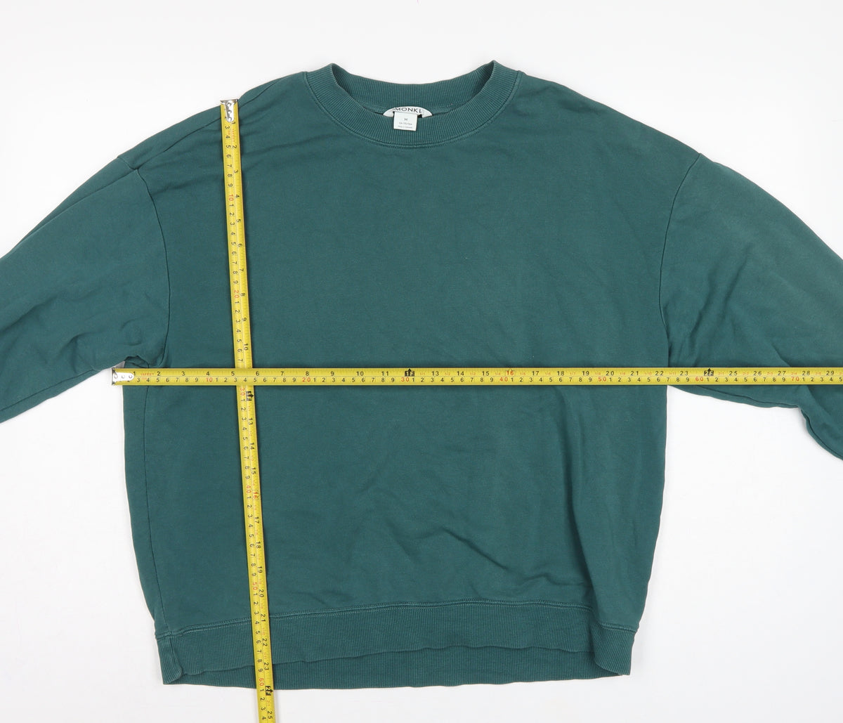 Close-up detail of Monki Women’s Green, size UK 12, Relaxed Crew Neck Pullover Sweatshirt