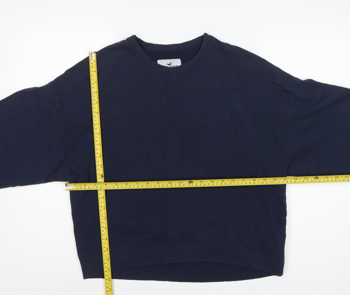 Close-up detail of Hollister Women’s Blue M Logo Crew Neck Pullover Sweatshirt