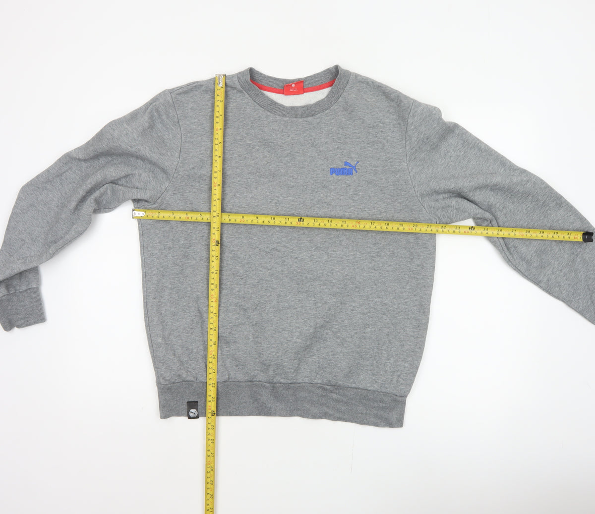 Close-up detail of Puma Men’s Grey M Pullover Crew Neck Embroidered Logo Sweatshirt