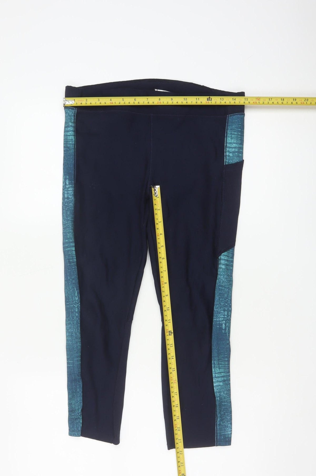Close-up detail of Decathlon women’s blue l gym training colourblock pocket leggings
