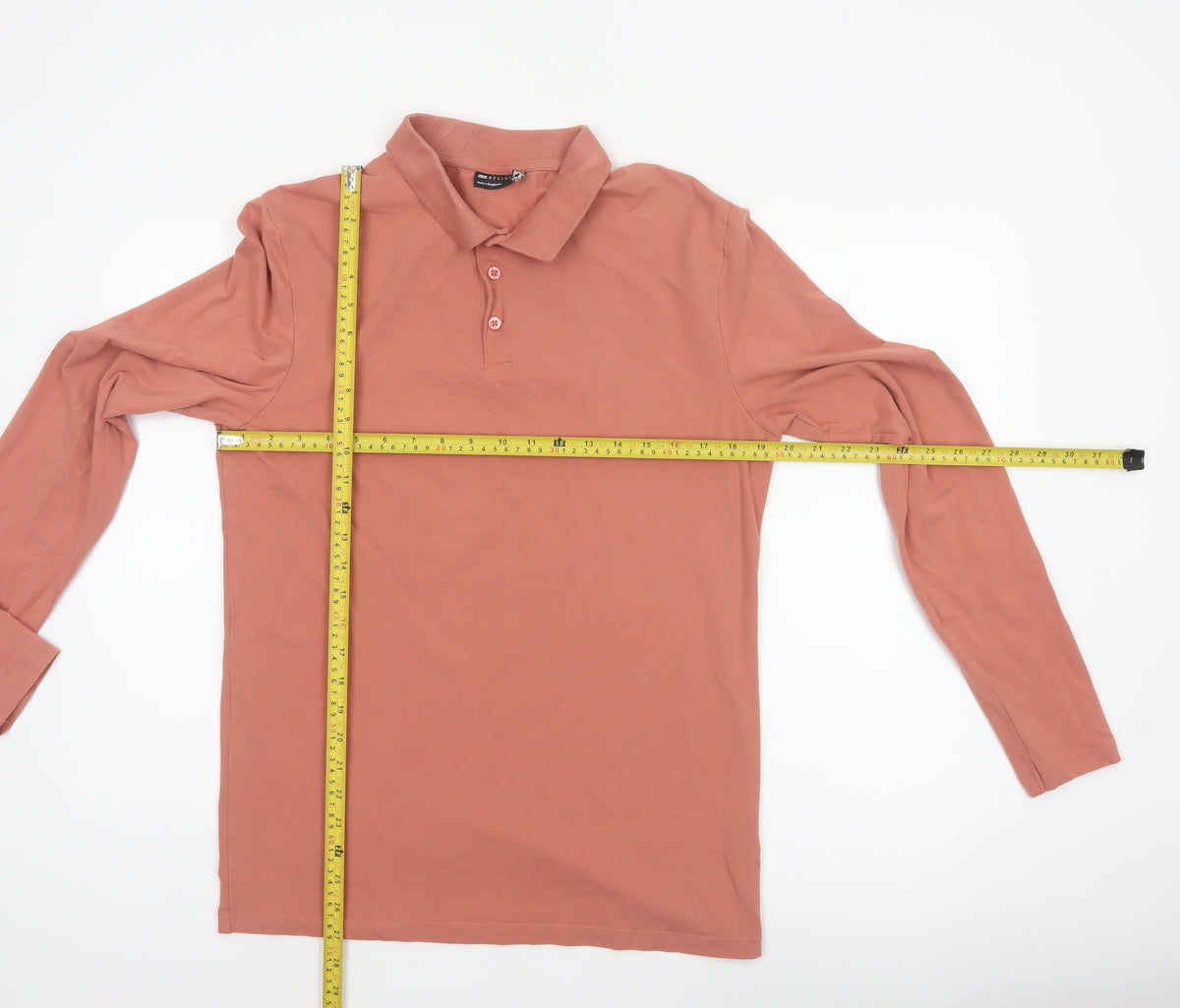 Close-up detail of ASOS DESIGN Men’s Pink XL Long Sleeve Button Polo Shirt