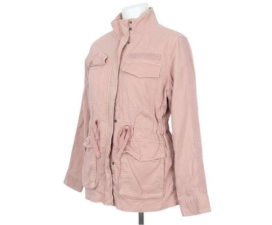 Prewornwholesale pink cotton military jacket with front flap pockets and drawstring waist on a mannequin