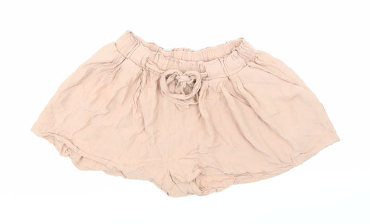 Front view of H&M women’s pink hot pants shorts, size UK 6